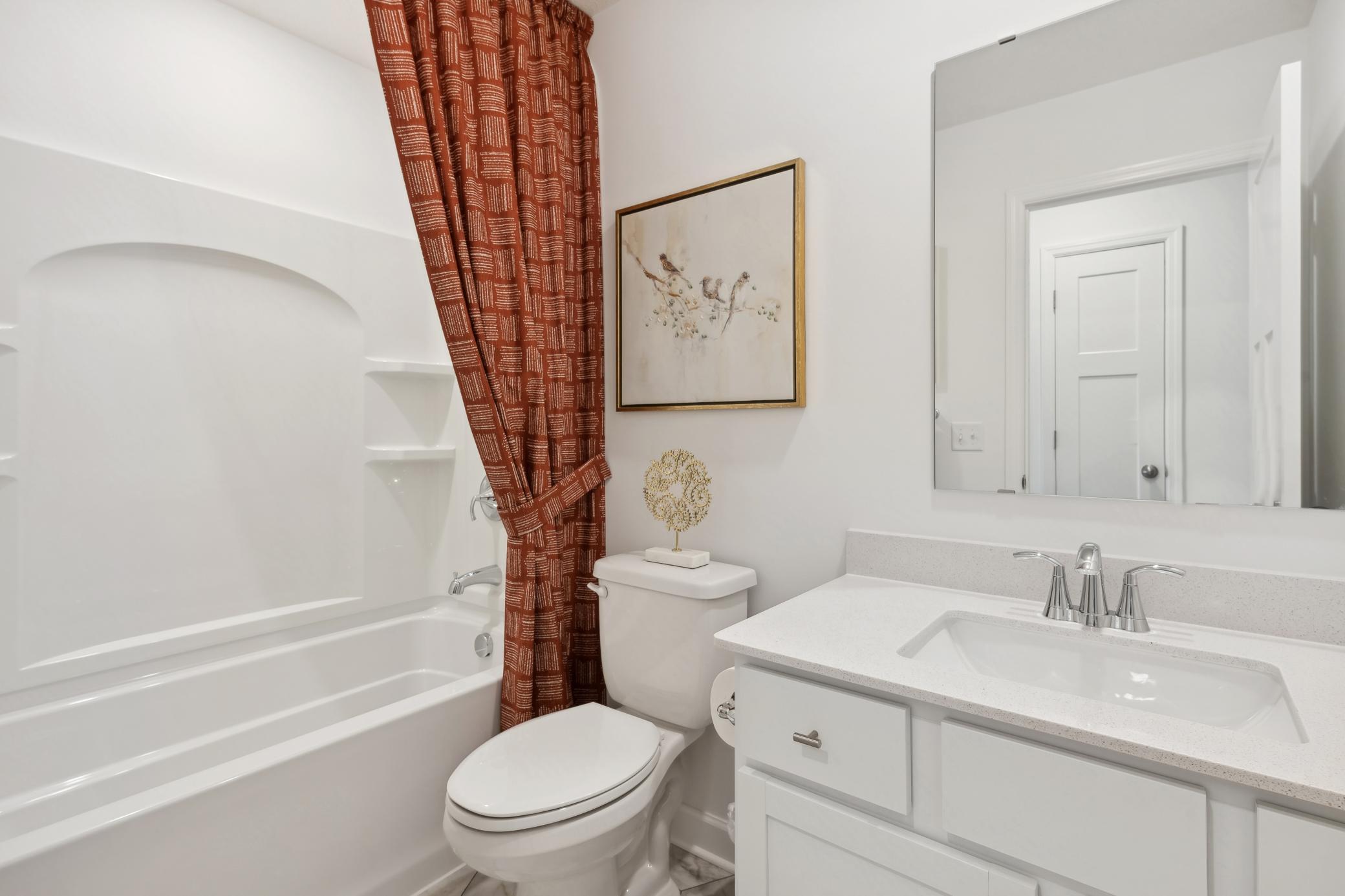 (Photo of decorated model, actual home's finishes will vary) A full bath located on the main floor!