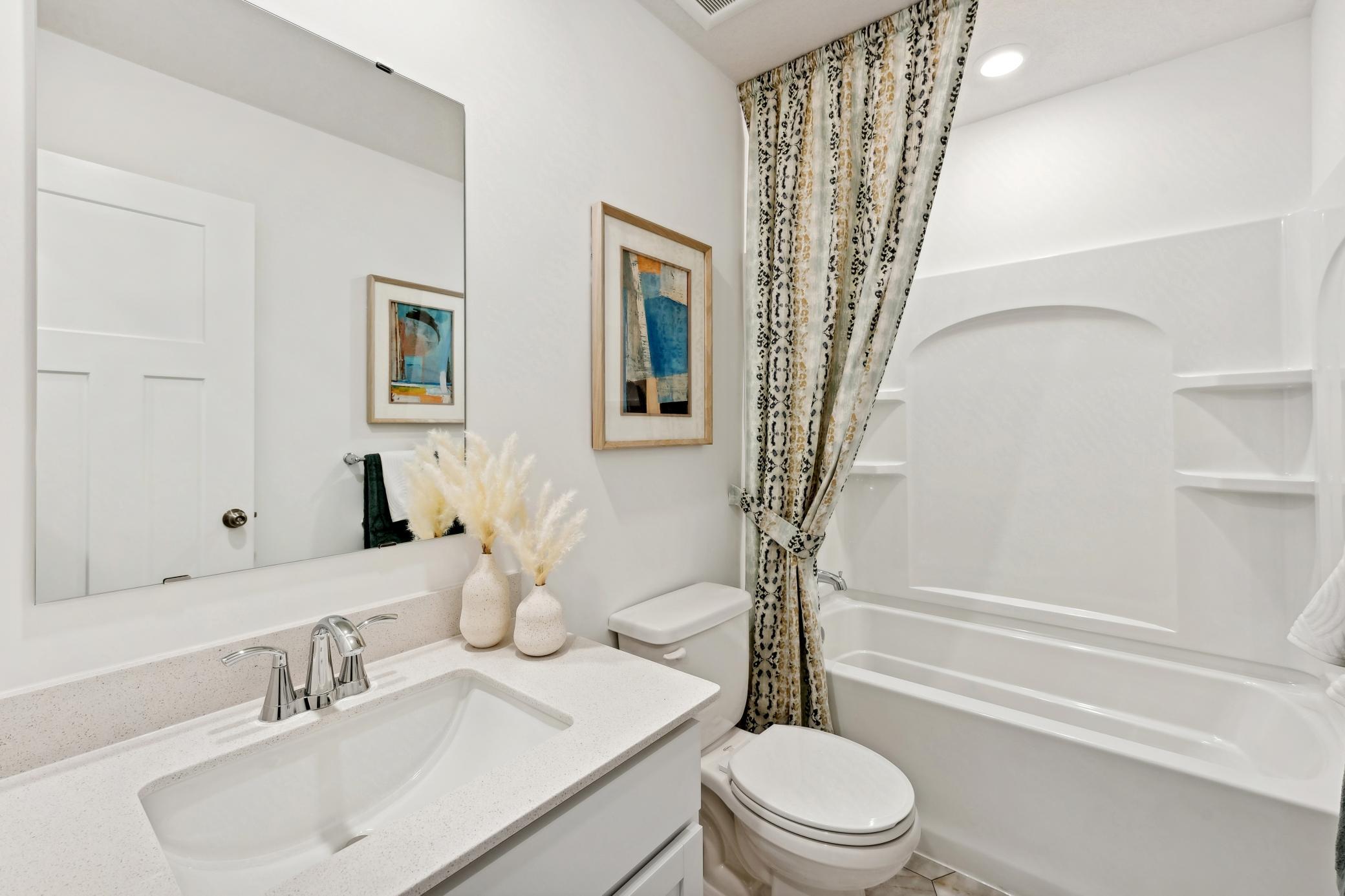 (Photo of decorated model, actual home's finishes will vary) This model has a full bath in the finished basement!
