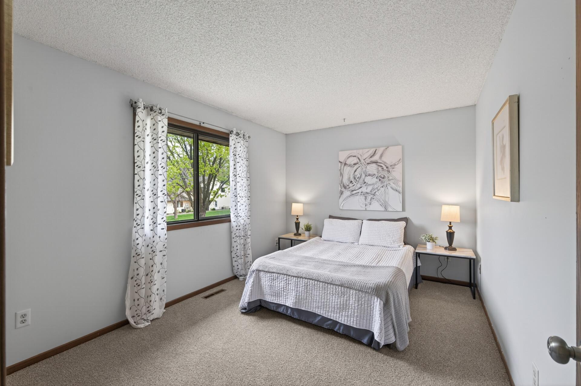 Upper level primary bedroom with walk-in closet