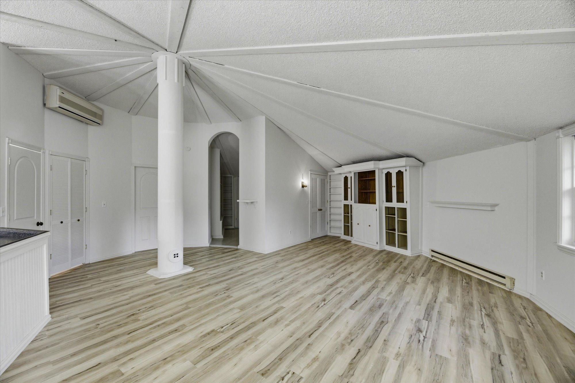 New Flooring & Paint. This area Where Bookcase Is Was A 2nd Bed, Wall Was Removed But You Could Add Back.
