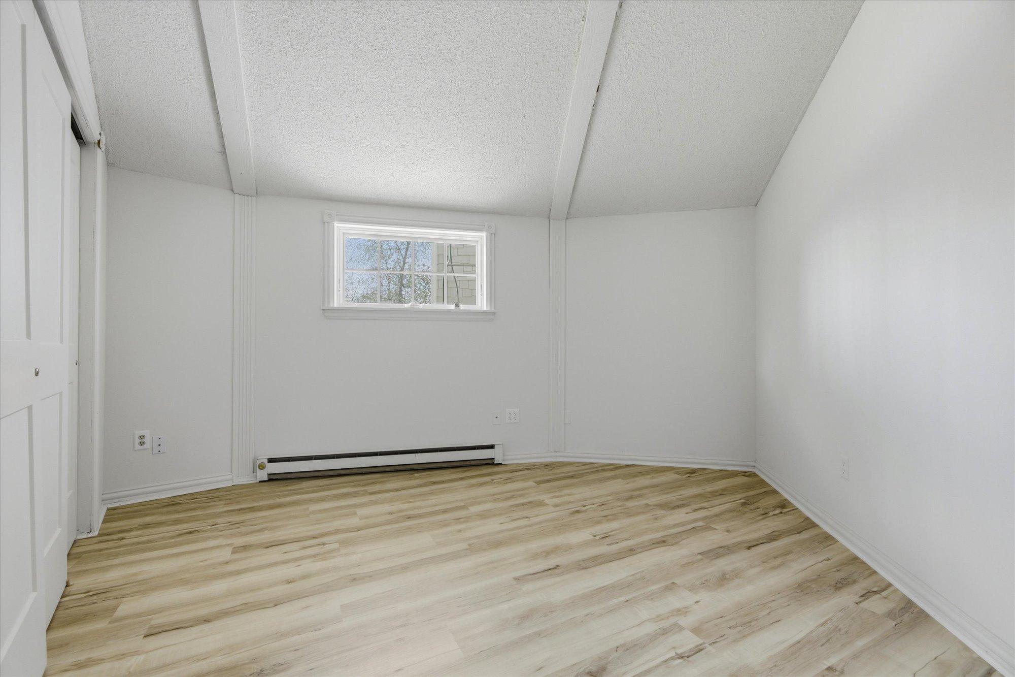 House Bedroom. New Flooring, Paint, And Closet Door.