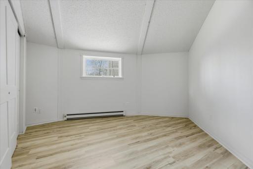 House Bedroom. New Flooring, Paint, And Closet Door.