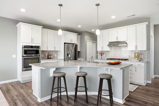 View of Gourmet Kitchen and Center Island. Virtually Staged