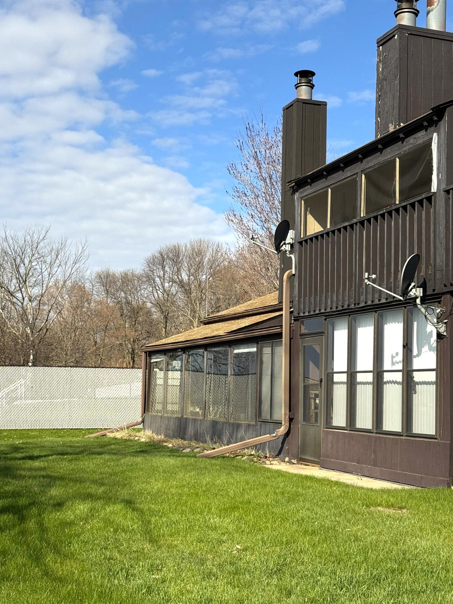 Ground view of the lake side of the condo. The open porch on the far side is for these two units.