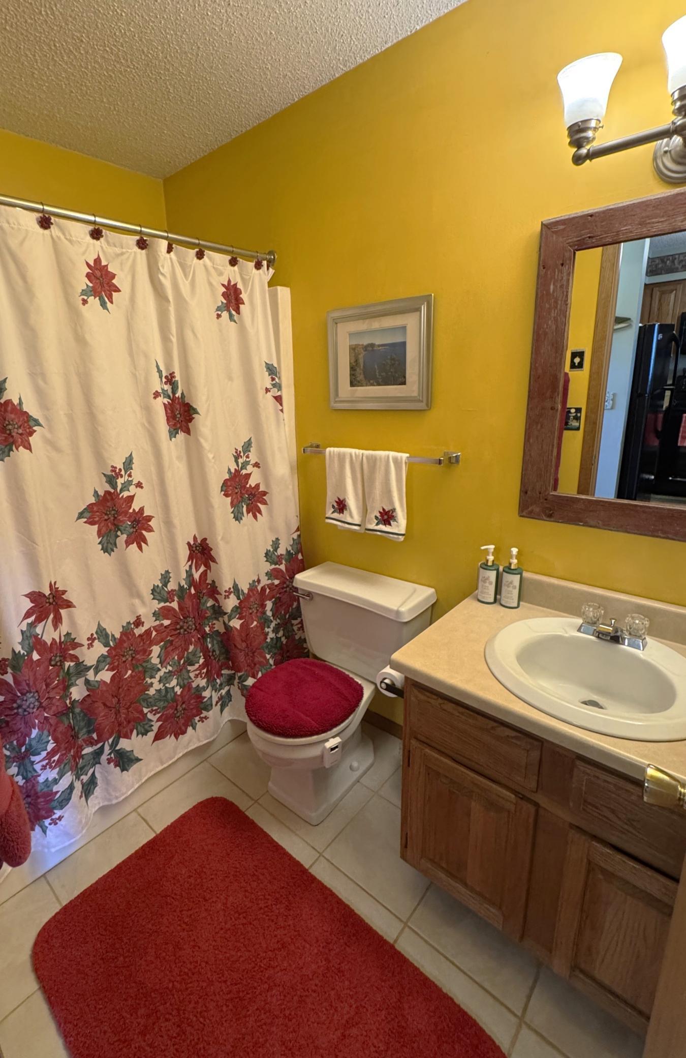Main floor full bath located right off the kitchen and rear entrance.