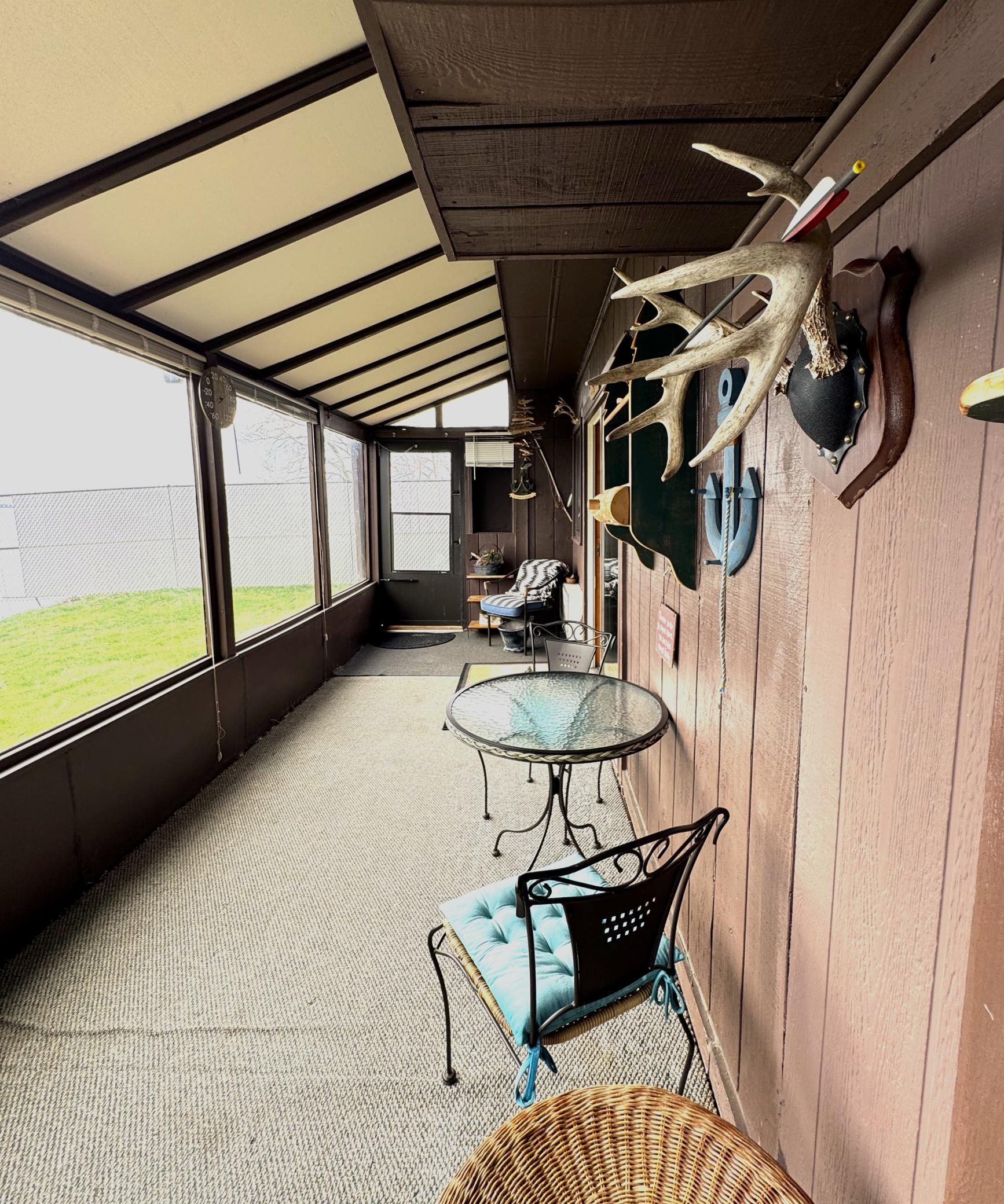 Lakeside porch that provides a quiet retreat............great place to sit and get out of the rain or away from the mosquitos.