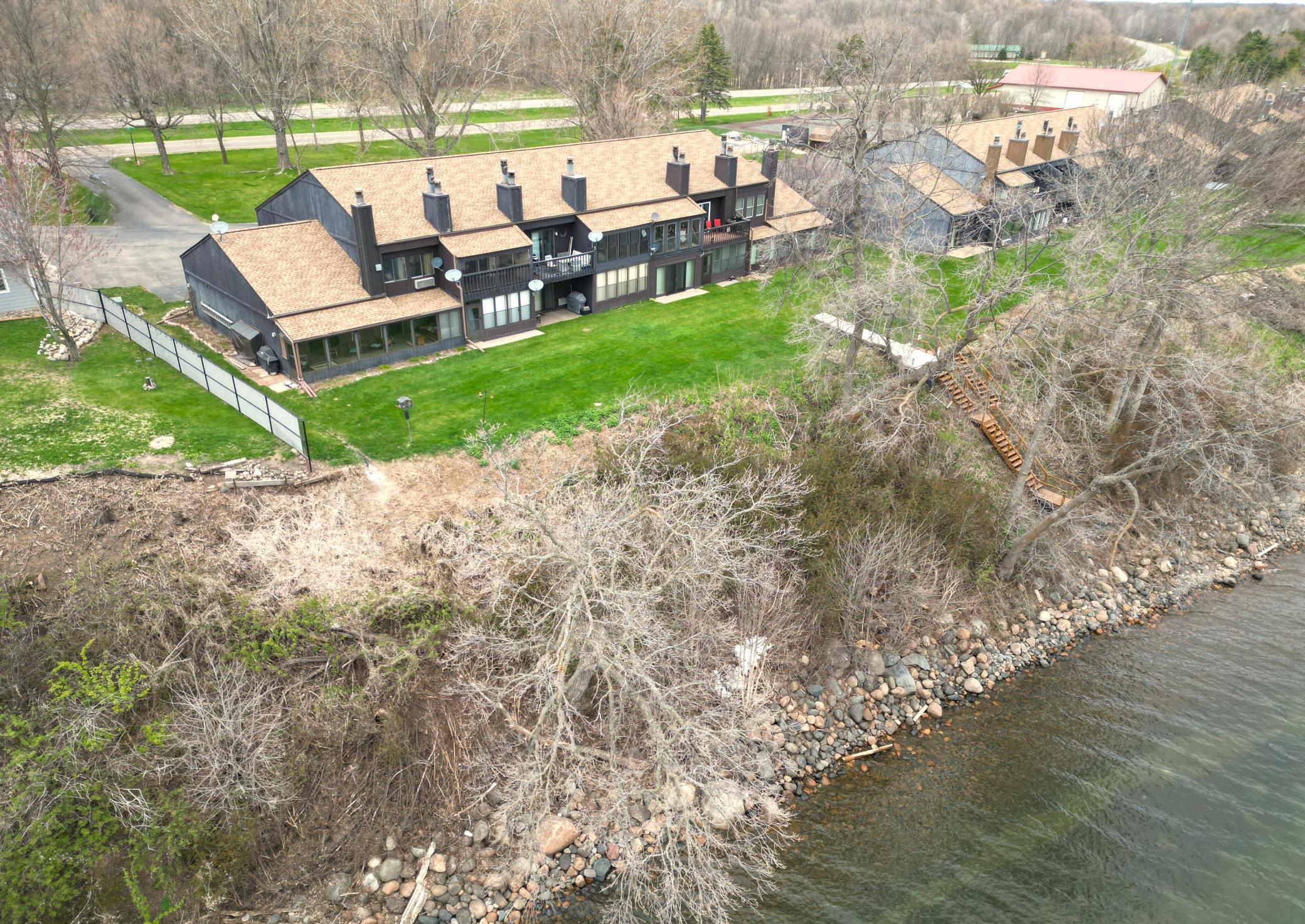 The shoreline is pretty rocky and sandy. There is a bit of a hill you'll climb from the dock at the waters edge to the condos.