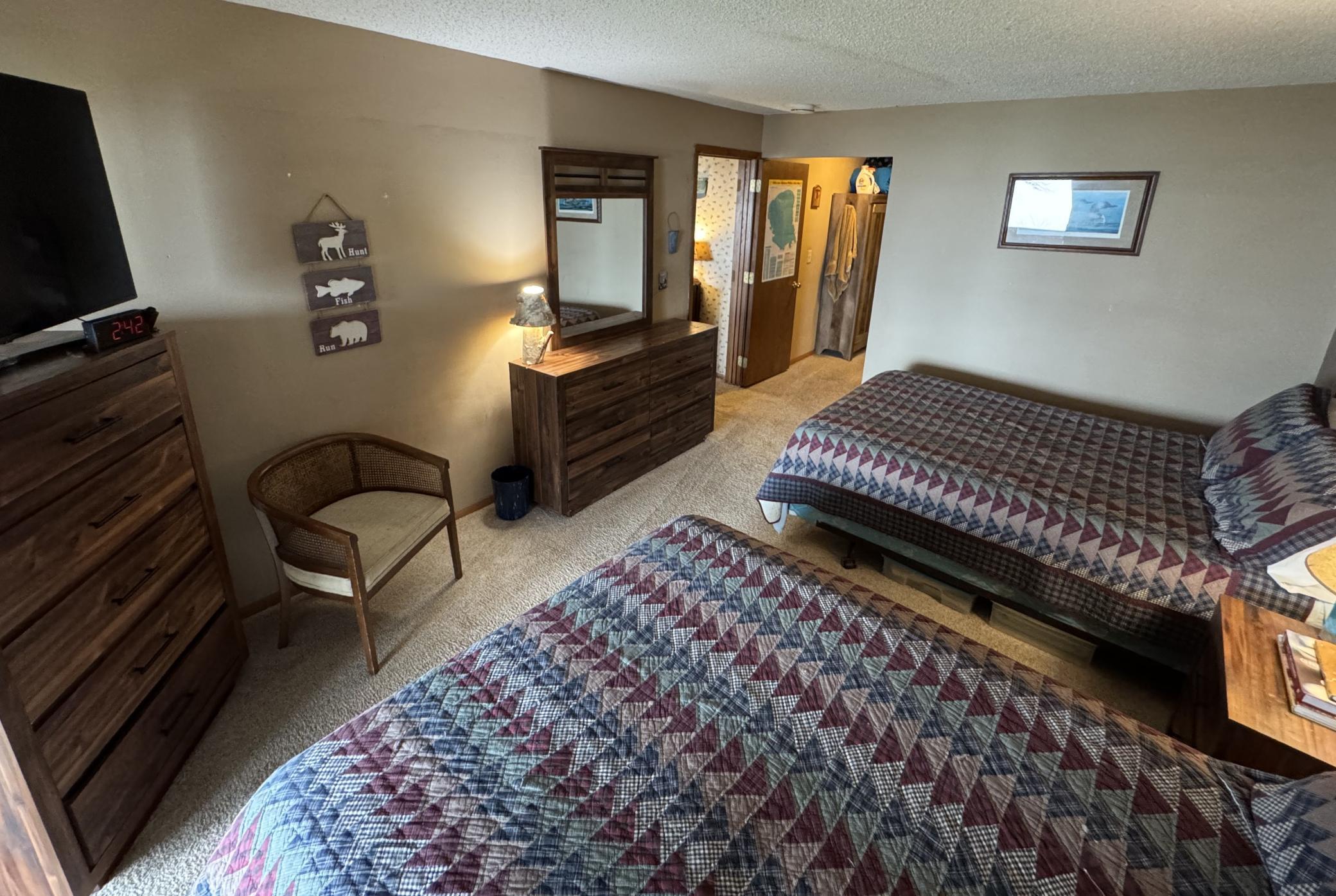 Another view of the bedroom. At the far end you'll find a corner area that gives you access to a 3/4 bath and the washer and dryer.