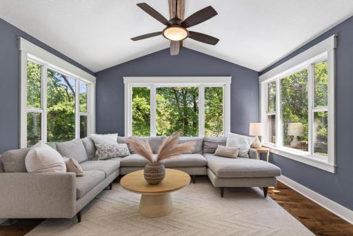 Four season porch with vaulted ceiling and access to the deck
