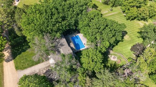 So many ways to enjoy the property wtih the pool, fire pit area and back flat lawn