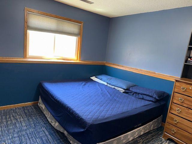 Third lower level bedroom has a built-in desk