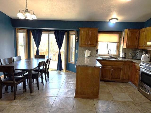 Open Kitchen and Informal Dining area have Ceramic Tile Floors.