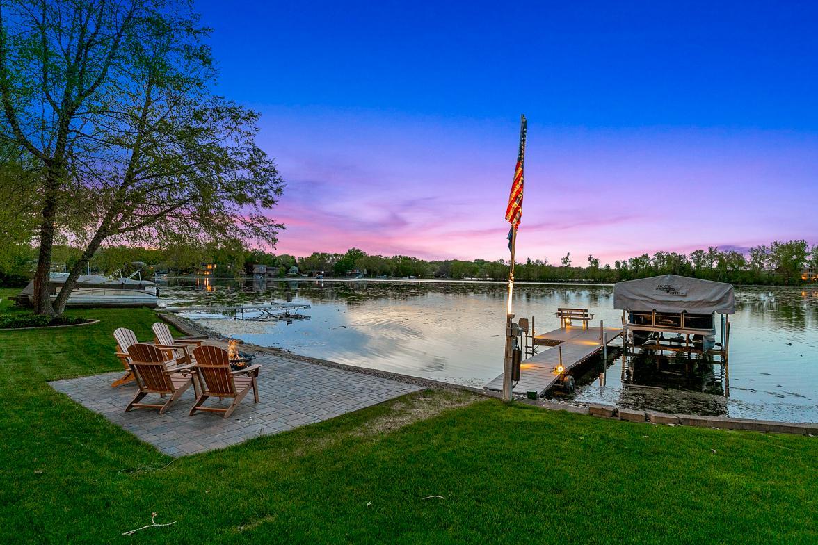110 ft of lake shore for boating, fishing, paddleboarding, and swimming, and evenings gathered around the fire pit watching unforgettable sunsets