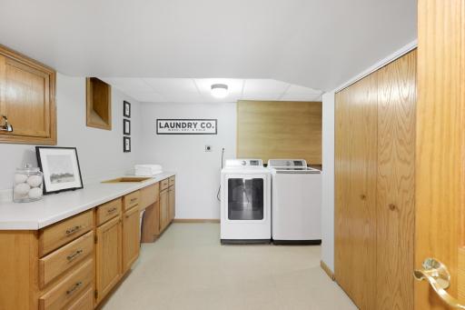 Oversized laundry room with extrodarnary storage