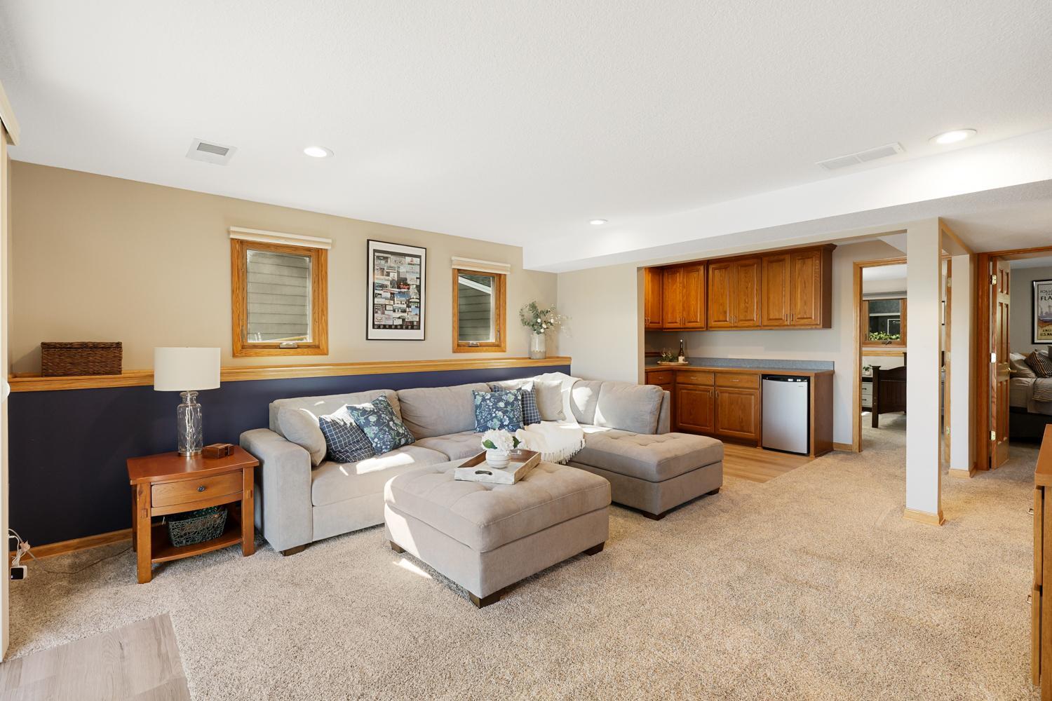 Lower level living room connected to two bedrooms and the wet bar