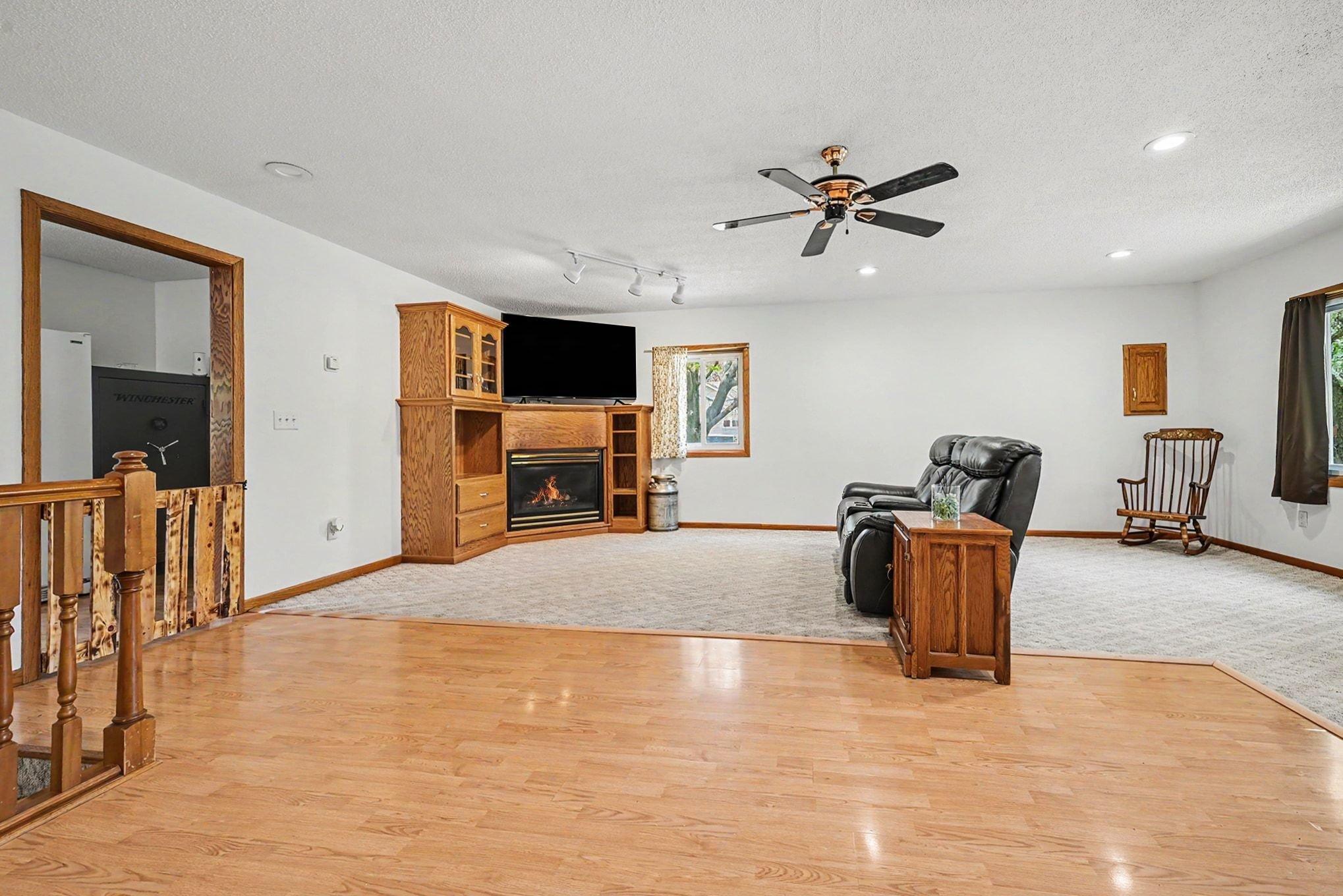 22x19 Main level family room with built in entertainment center and cozy gas fireplace