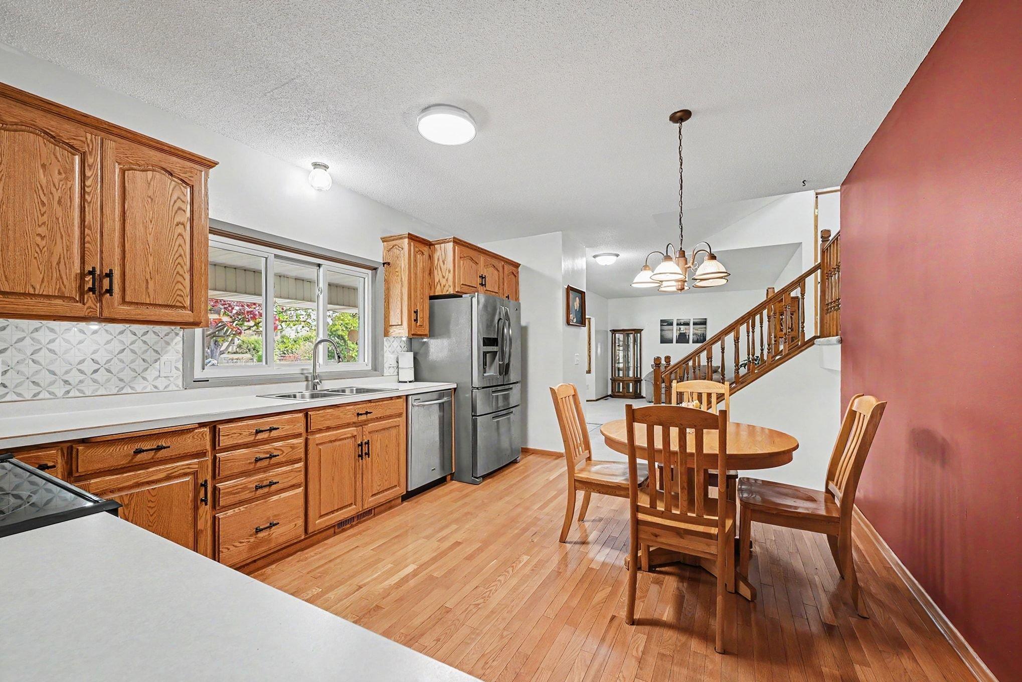 Three big windows over the sink for more natural light. Lots of room for entertaining.