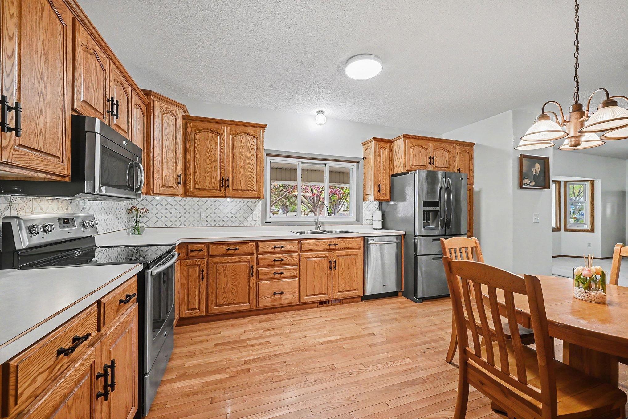 Hardwood floors and stainless appliances