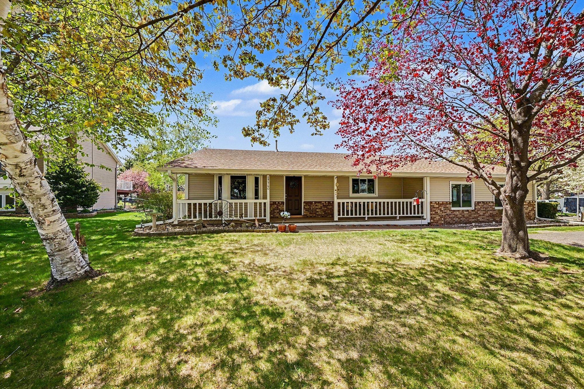 Large covered front porch and mature trees