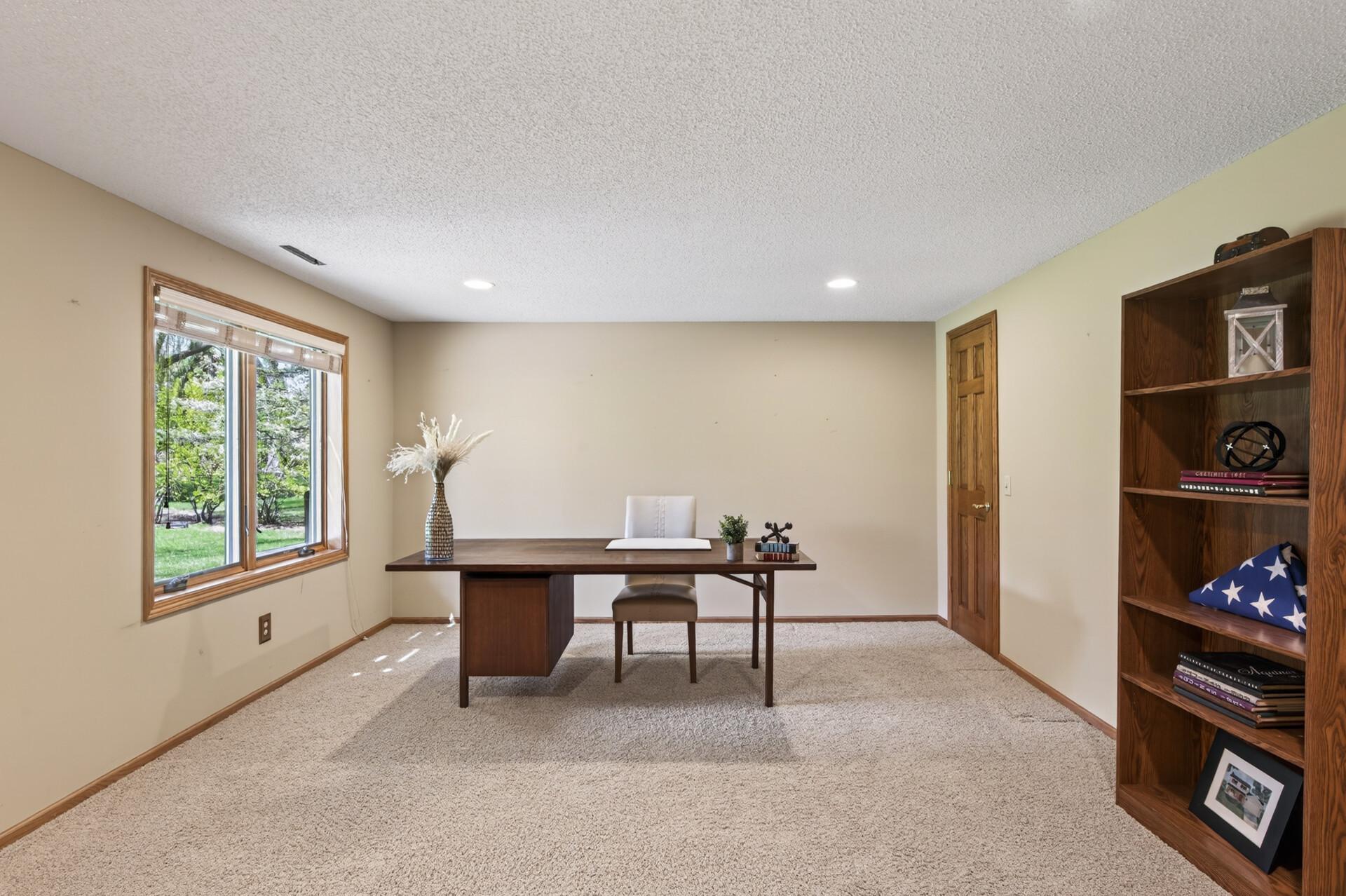 Large basement bedroom that doubles as an office