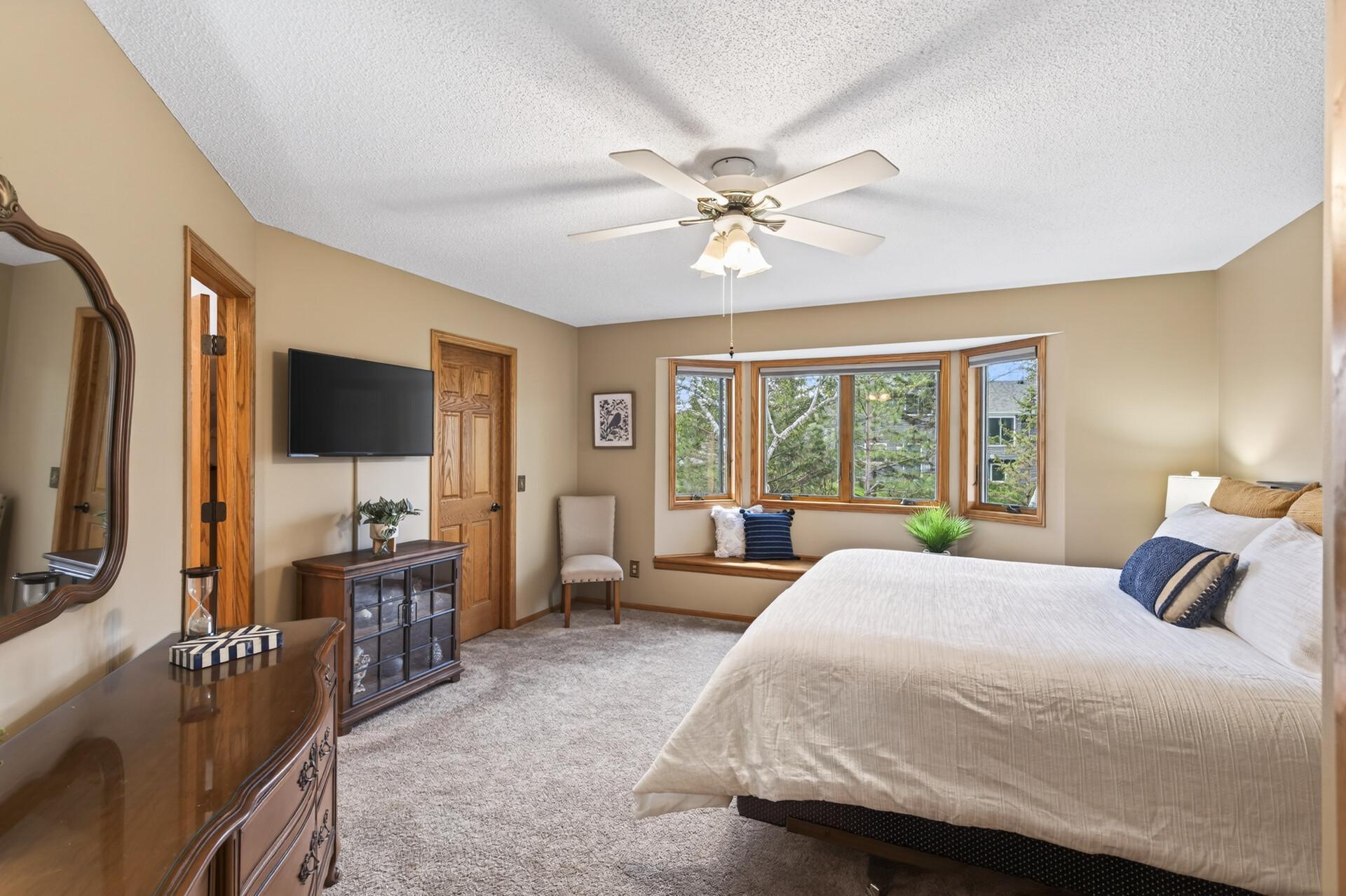 Primary bedroom with an abundance of natural light