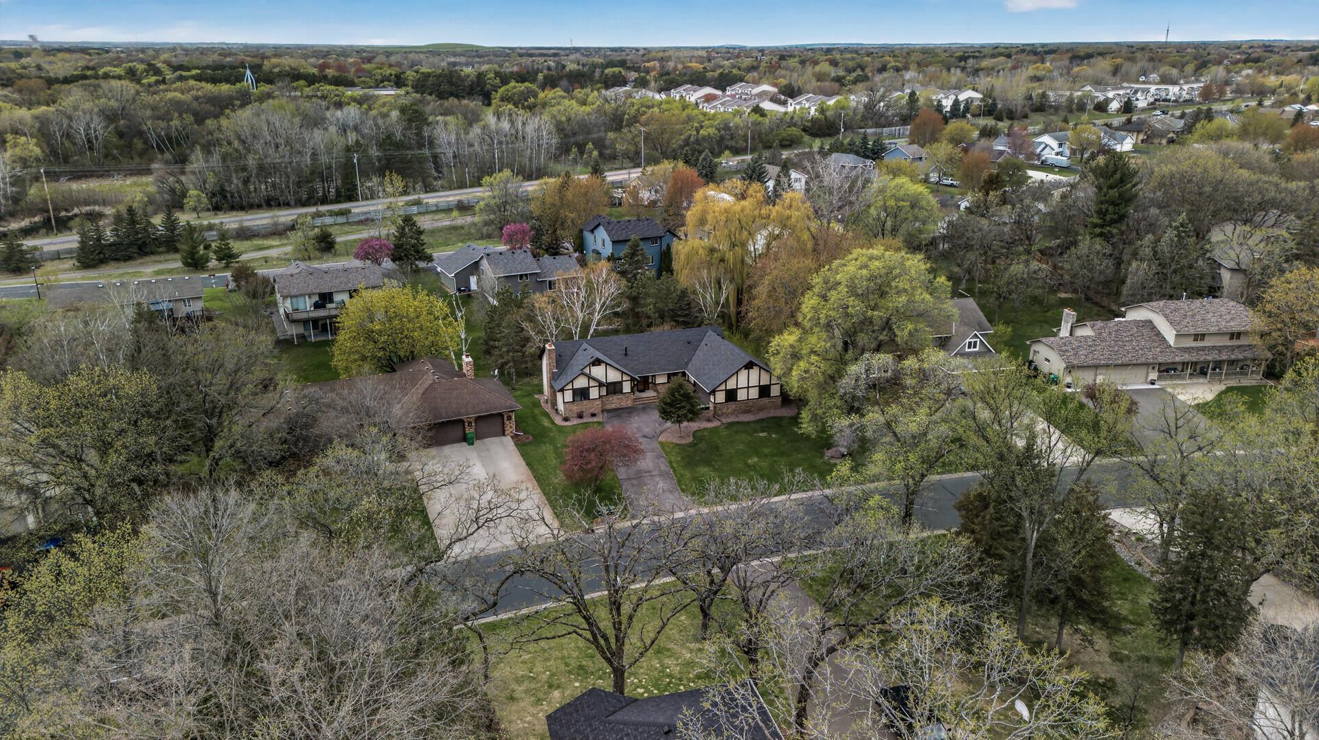 Mature trees surround the home