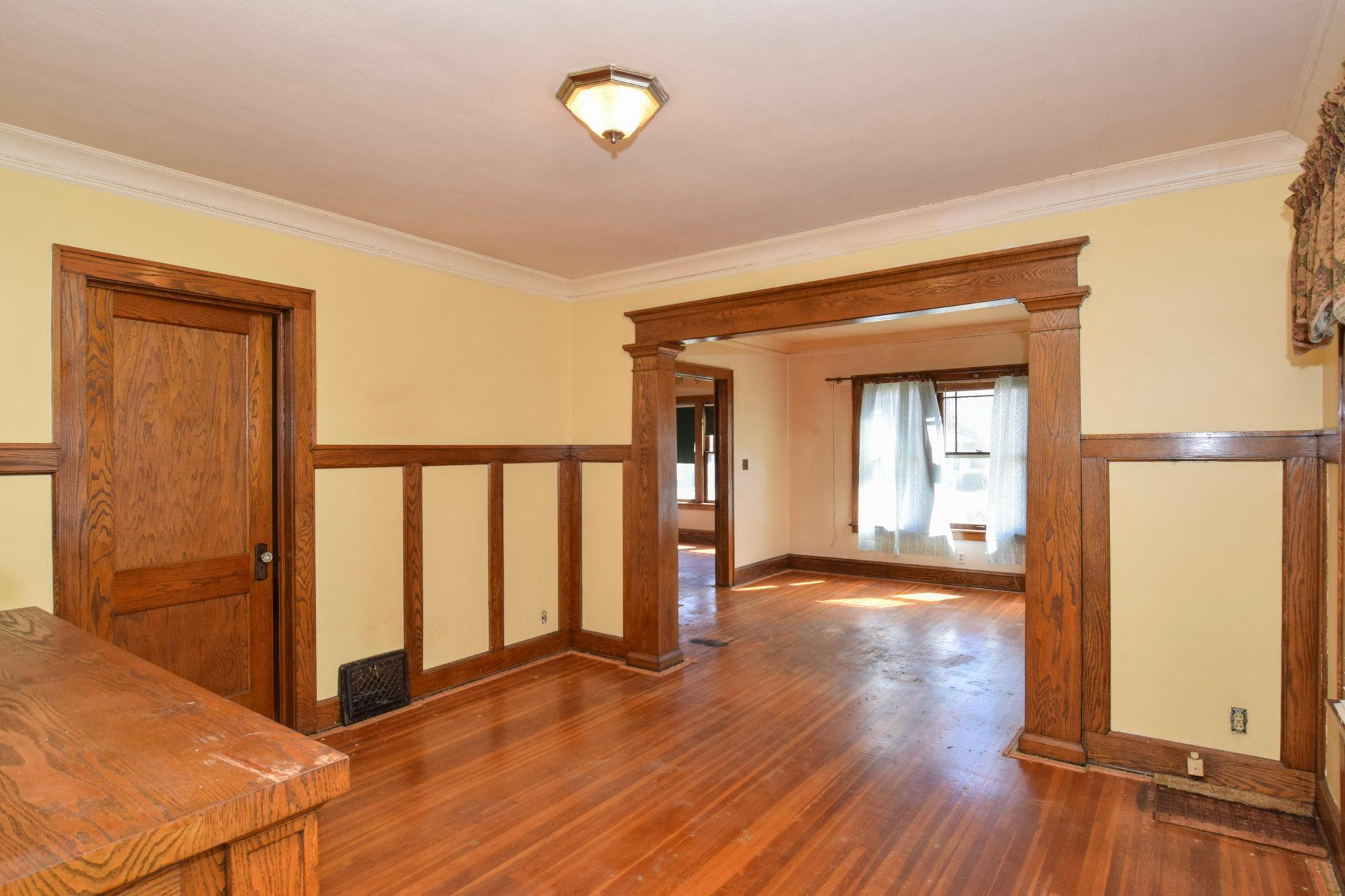 Dining room to living room-all original woodwork!