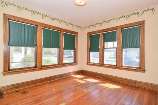 4 season porch--sunny inviting space to spend time! Hardwood floors!
