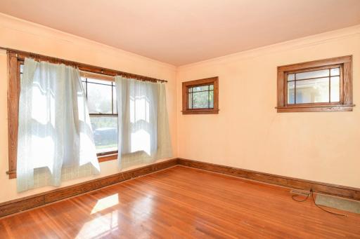 Living room-check out the coved ceiling & original millwork!