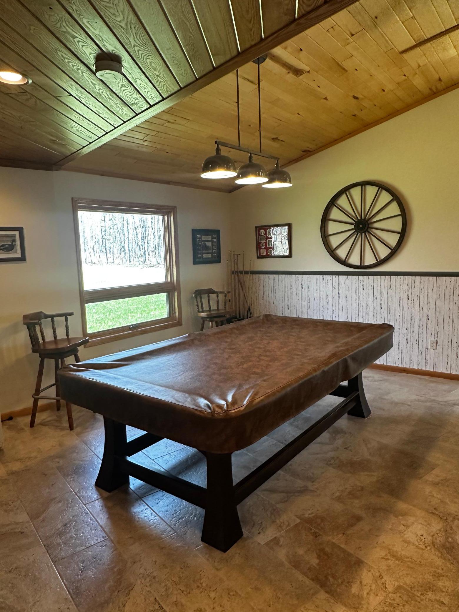 Gorgeous American Classic pool table with custom legs and felting to stay with home.