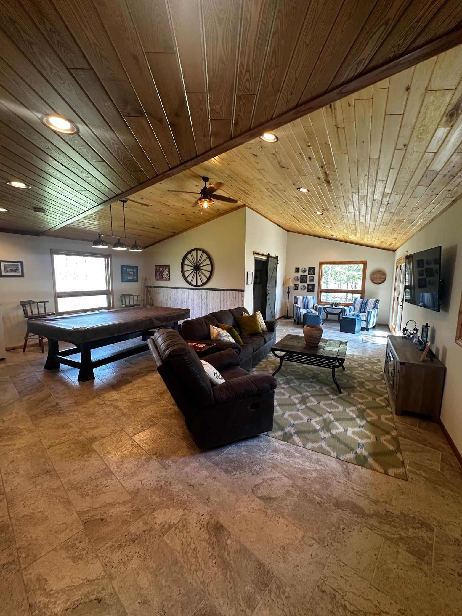 Family room and 2 additional main level bedrooms in this wing of the home.
