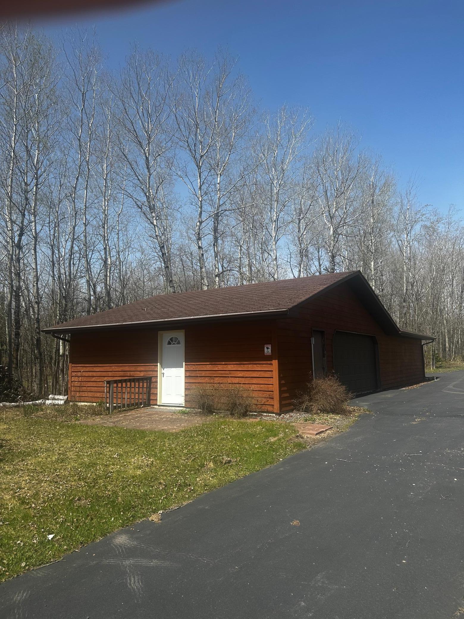 2nd "far garage" features storage, 4 car garage for plenty of boat and toy storage. White door goes into lakeside sauna!