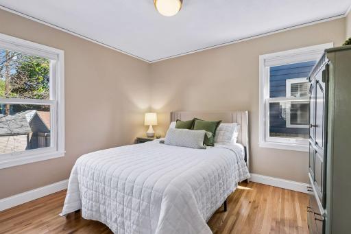 Bedroom 2- main floor bedroom- new ceiling light, beautiful hardwood floors, bright!