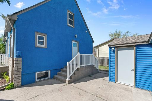 Side entrance to home to kitchen/basement stair area