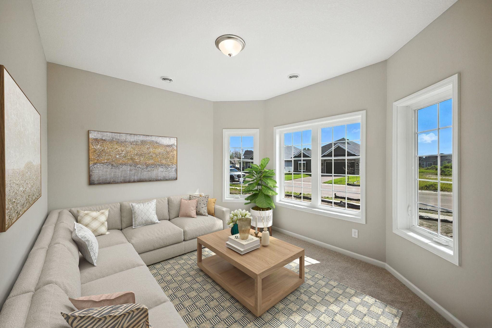 Den with plenty of natural light representational photo.