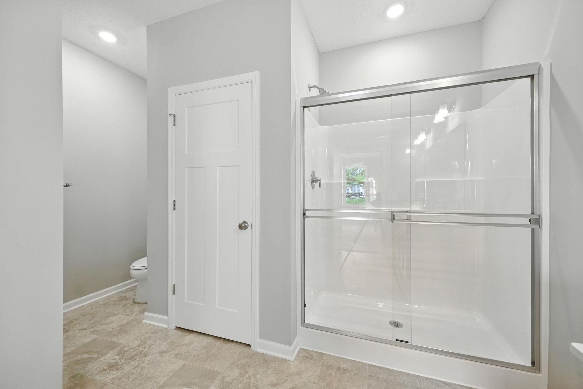 Owner's Bath, walk in shower representational photo.