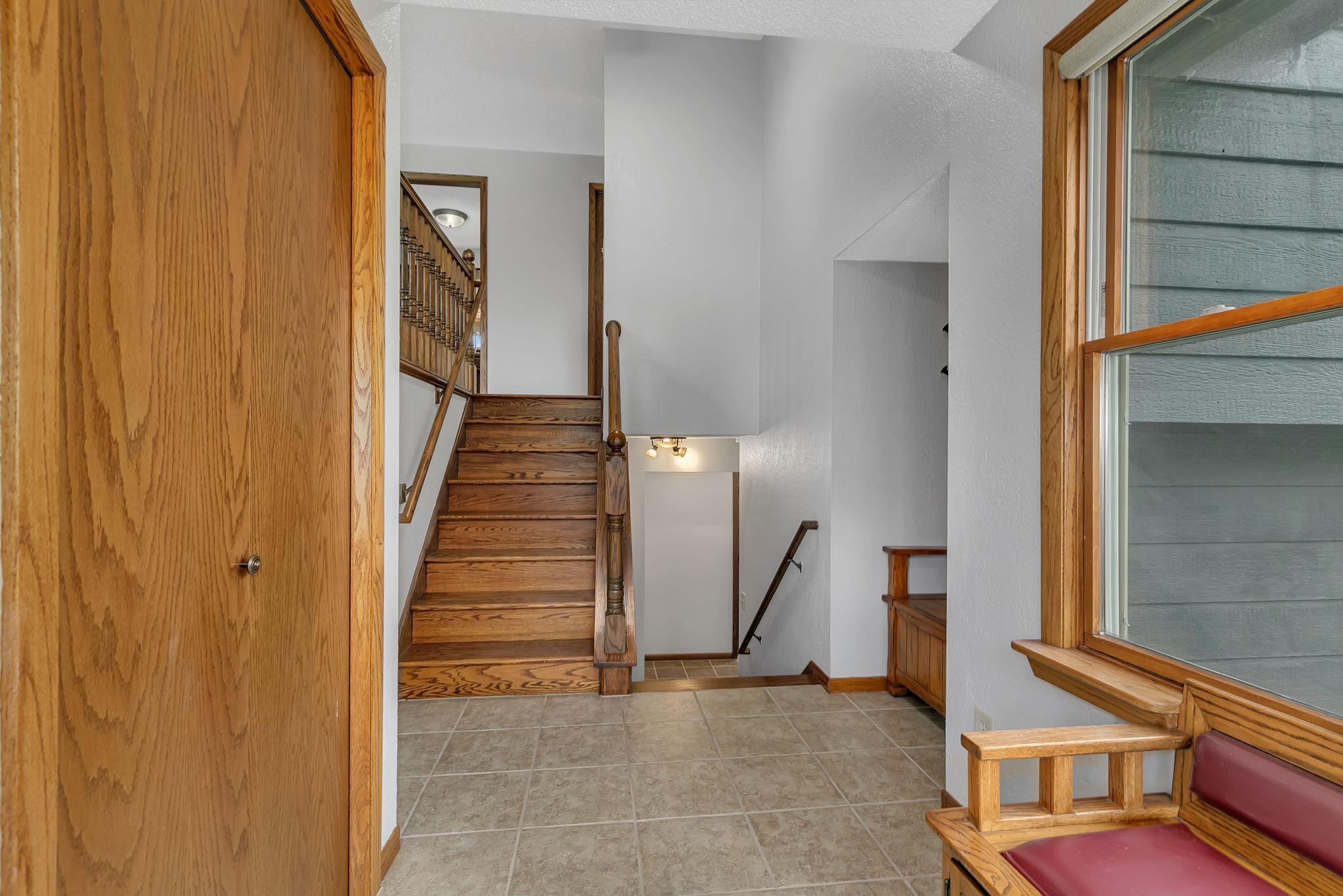 Large welcoming foyer with closet and 2 built in benches with storage. This home has been well loved and cared for. Fresh ceiling & wall paint throughout.