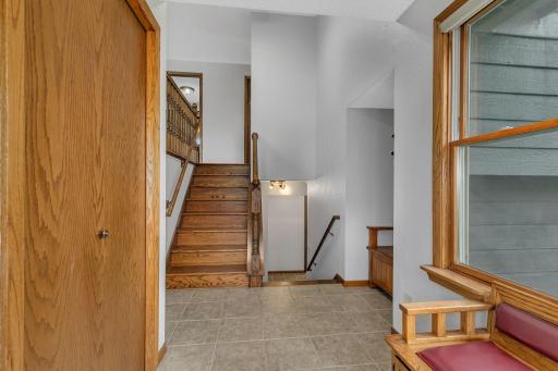 Large welcoming foyer with closet and 2 built in benches with storage. This home has been well loved and cared for. Fresh ceiling & wall paint throughout.
