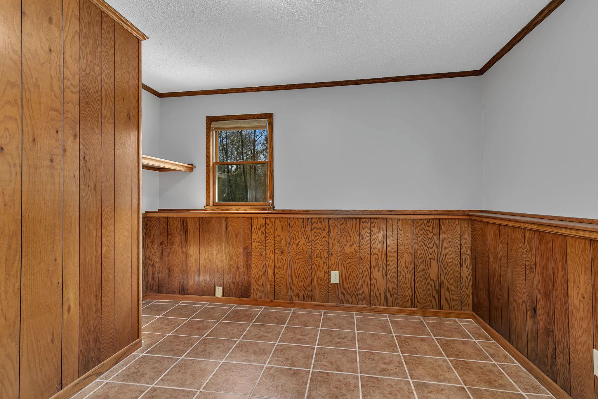 Another view of the basement bedroom. This would make a great office space as it does not have a closet.