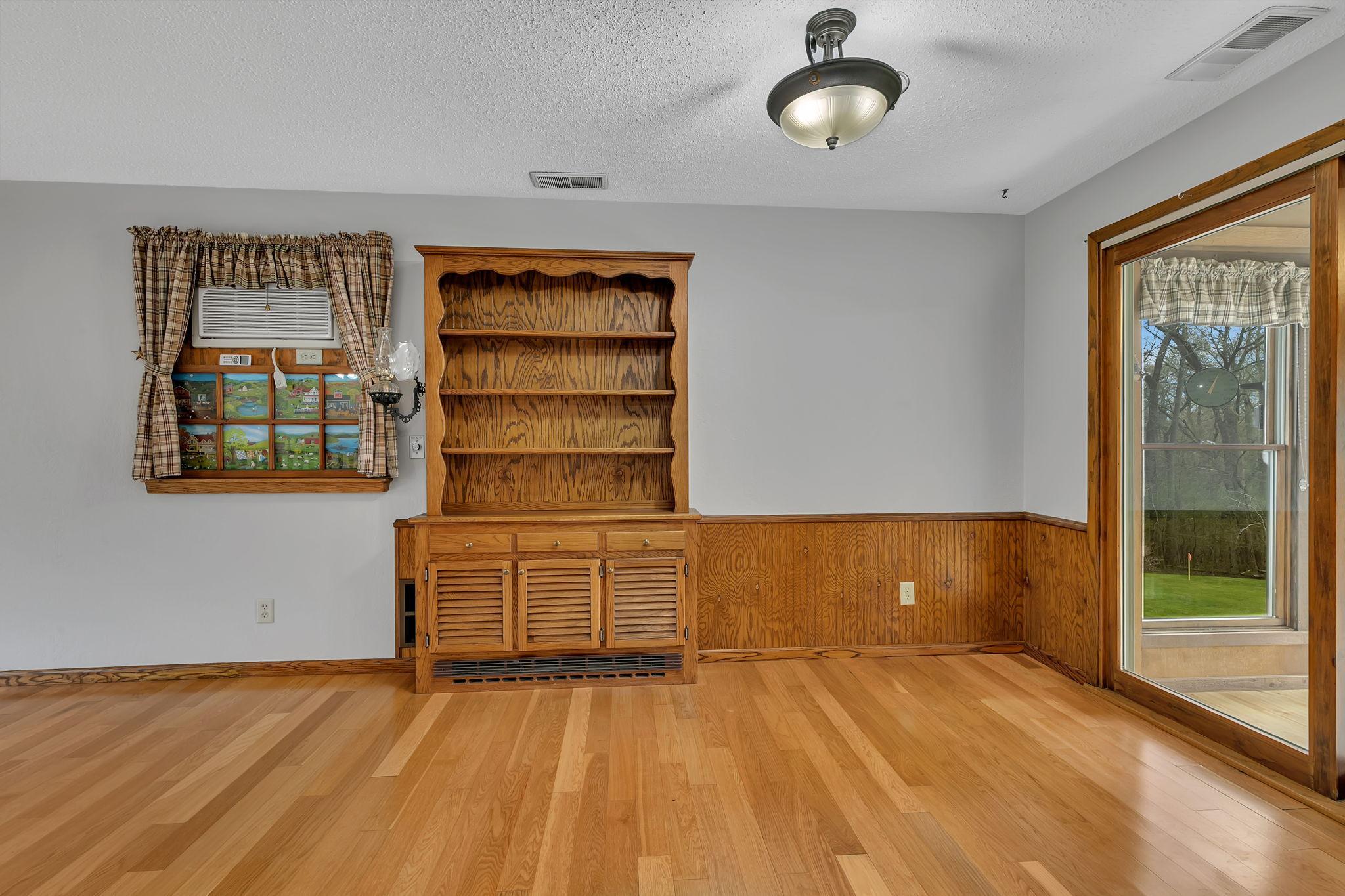 Another view of the dining area looking from the kitchen. The "window" to the left is one of a few unique features this home has to offer.