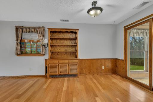 Another view of the dining area looking from the kitchen. The "window" to the left is one of a few unique features this home has to offer.