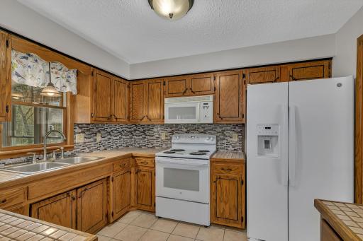 Another view of the kitchen showing just how much storage and prep space there is.