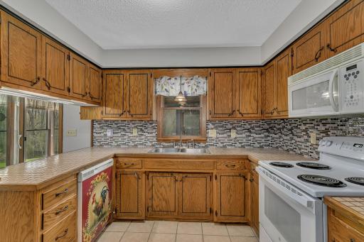 Welcome to your new gourmet experience. This kitchen offers a ton of storage and counter space for meal rep and offers updated backsplash. Appliances have been updated in the last few years.