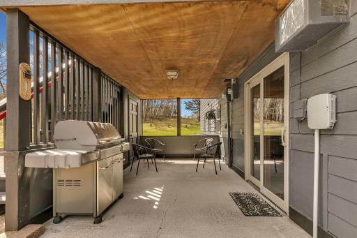 Enjoy the outdoors on this covered patio. The patio door leads into the family room. Convenient for cooking.