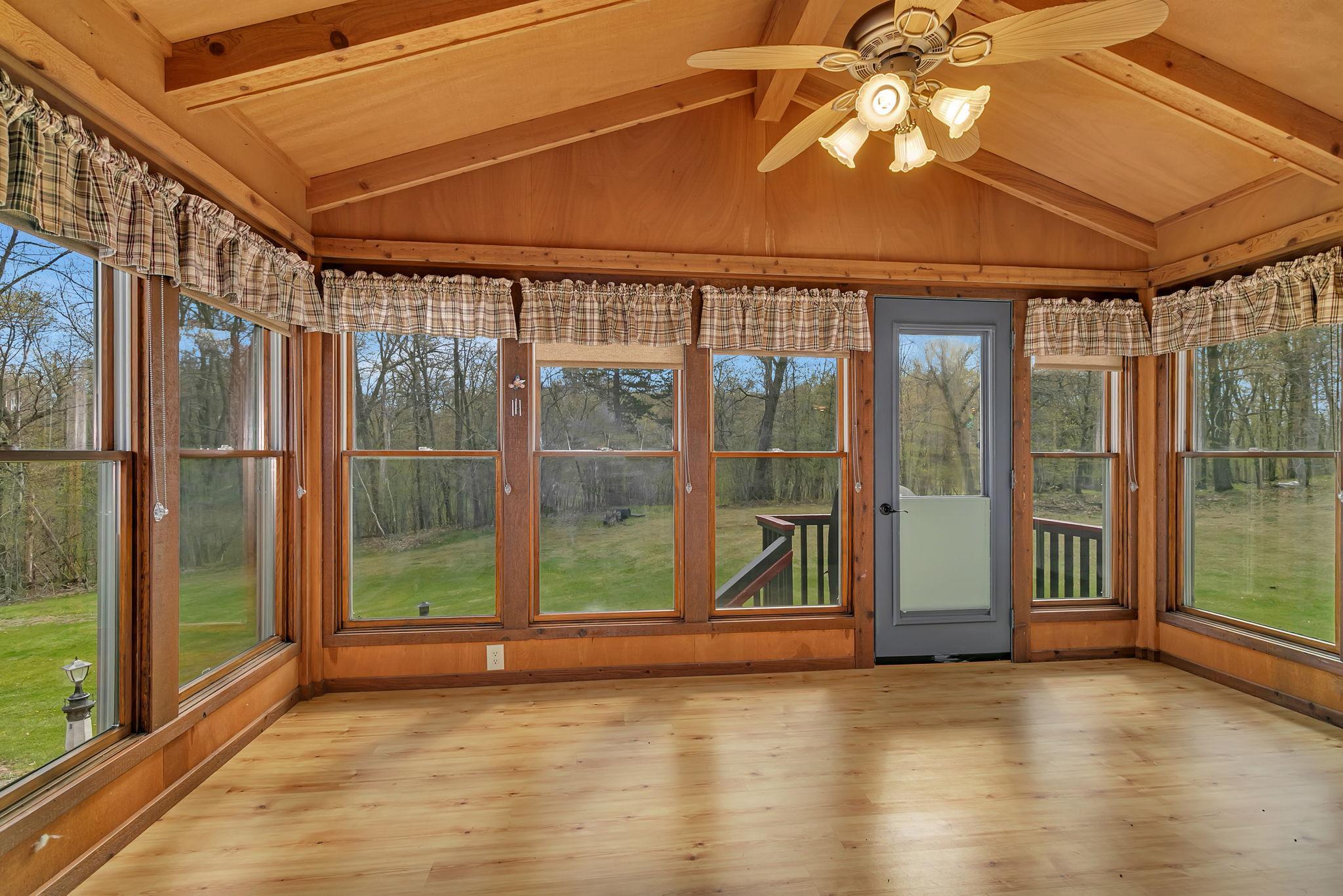 Four season porch is a great space to sit and enjoy your morning coffee while watching nature. This room will become your favorite spot to spend time!