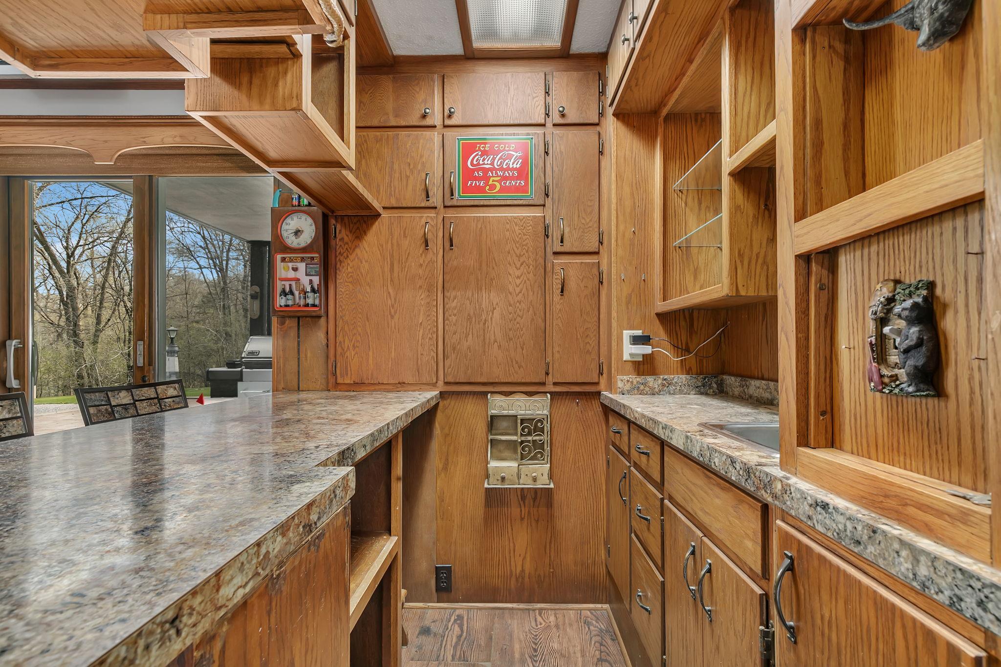The Popcorn Pub has a spot for everything. There is a space under the bar for a fridge along with storage for any of the other necessary items used at the pub.