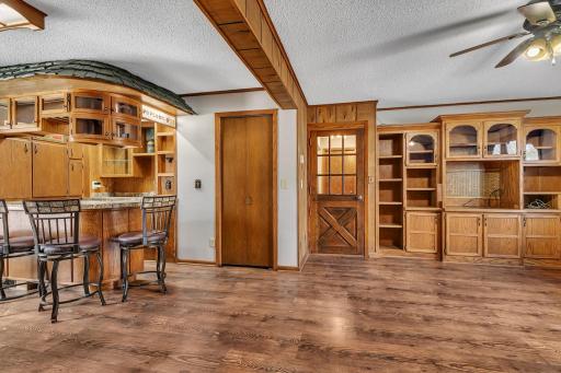 View of the pub looking towards the hallway and family room area. Coat closet next to the pub. This room is large enough to fit any amount of furniture. It also offers some really nice built-ins.