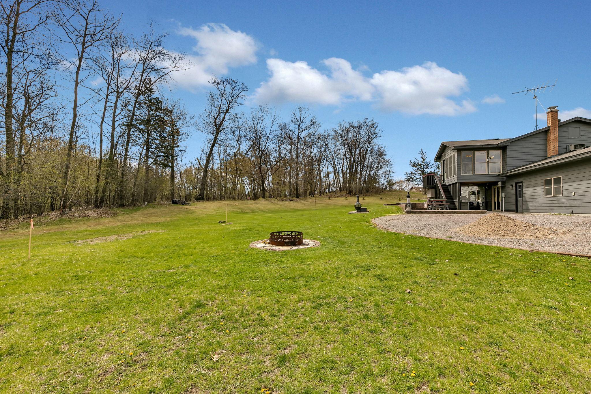 Enjoy bonfires right outside your back door. This is a great level area in the yard to enjoy smores and hotdogs over the fire.