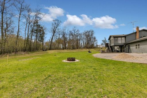 Enjoy bonfires right outside your back door. This is a great level area in the yard to enjoy smores and hotdogs over the fire.