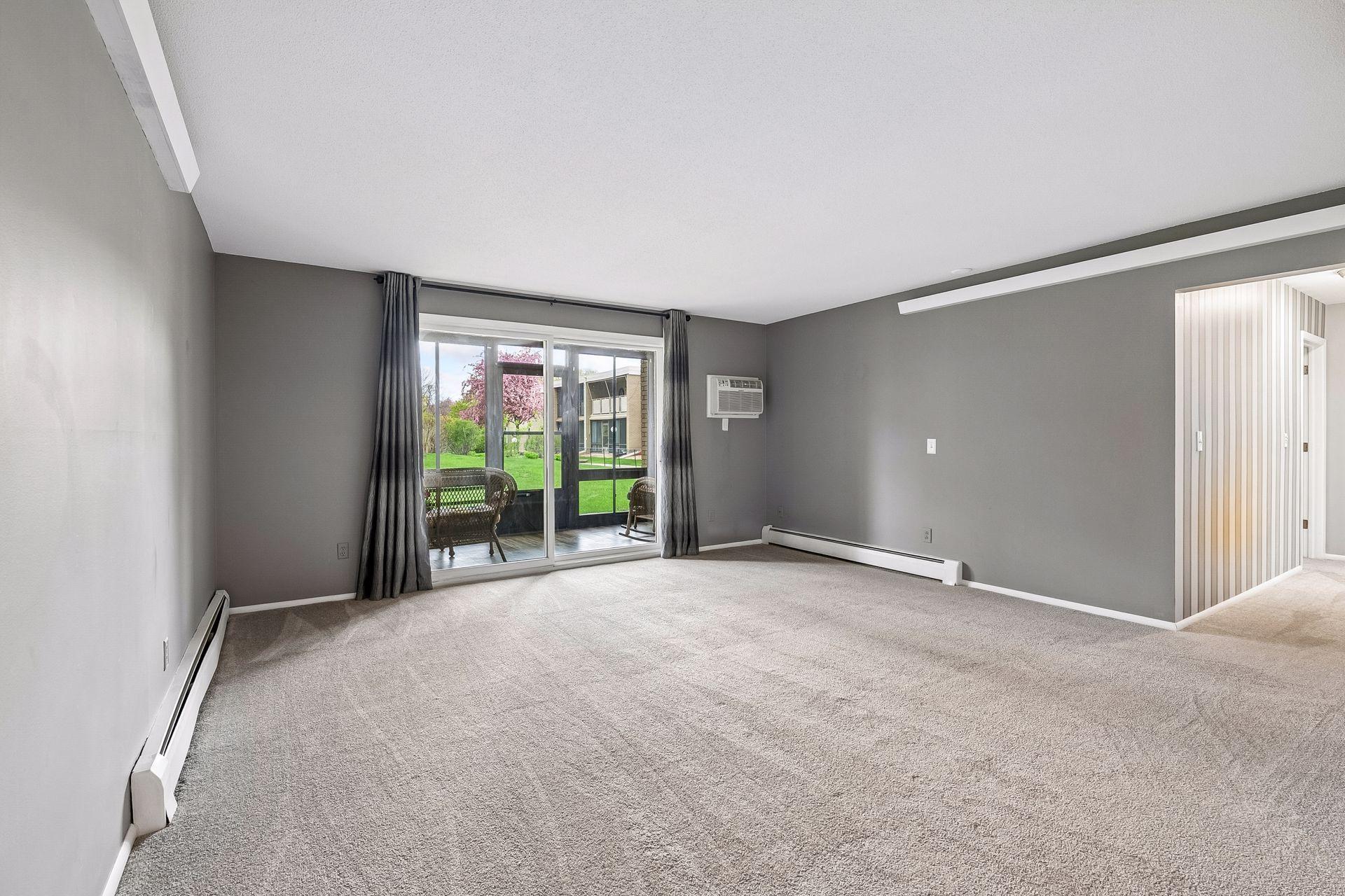 Living room leads to delightful porch